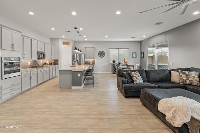 living room with ceiling fan