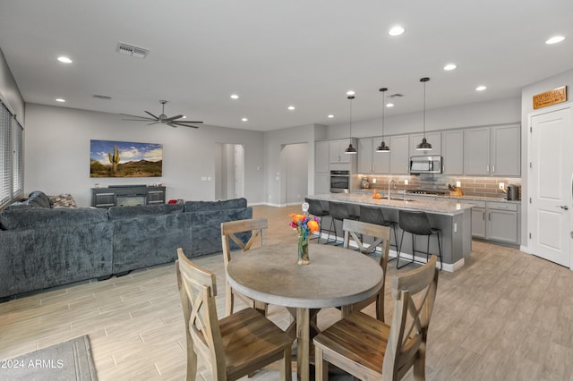 dining space with ceiling fan