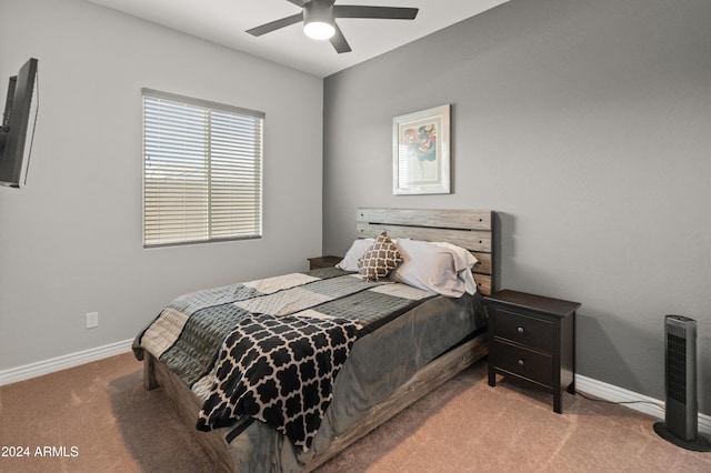 bedroom featuring ceiling fan and carpet