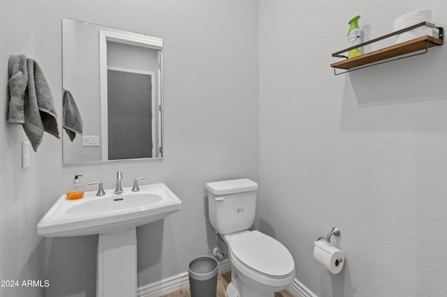 bathroom with sink and toilet