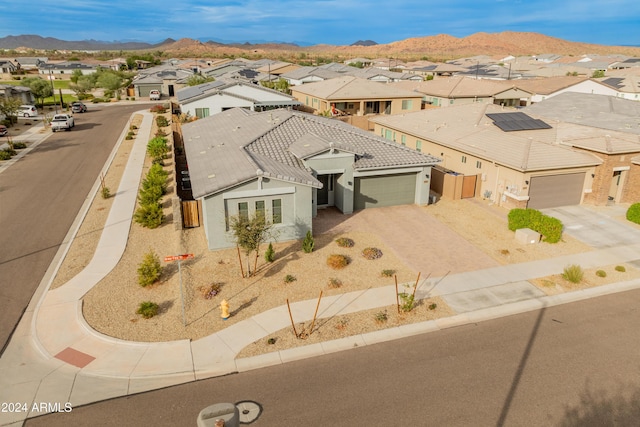 birds eye view of property featuring a mountain view