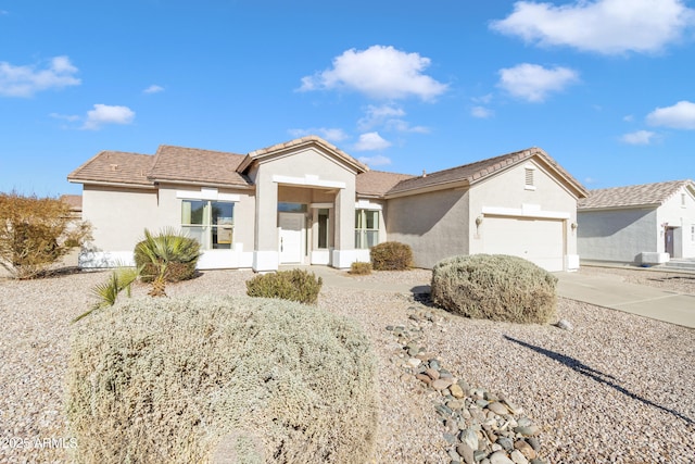 ranch-style house featuring a garage