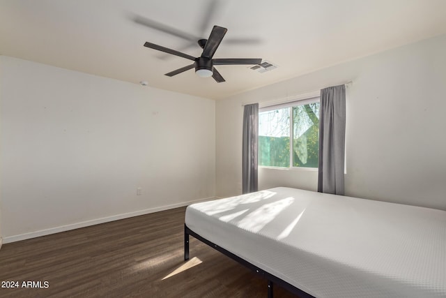 7394 N 67th Dr, Glendale, AZ 85303 - bedroom with wood finished floors, visible vents, baseboards, and ceiling fan