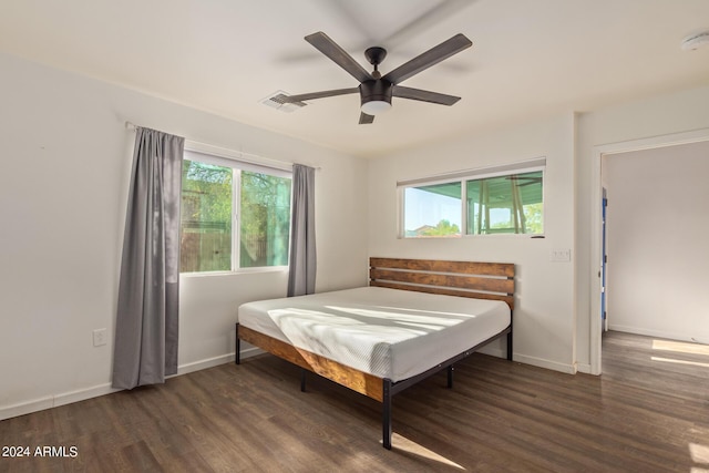 7394 N 67th Dr, Glendale, AZ 85303 - bedroom featuring wood finished floors, visible vents, baseboards, and ceiling fan