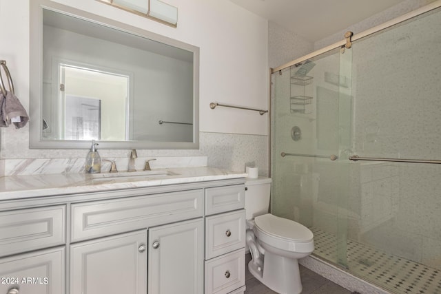 7394 N 67th Dr, Glendale, AZ 85303 - full bathroom with toilet, vanity, and a stall shower