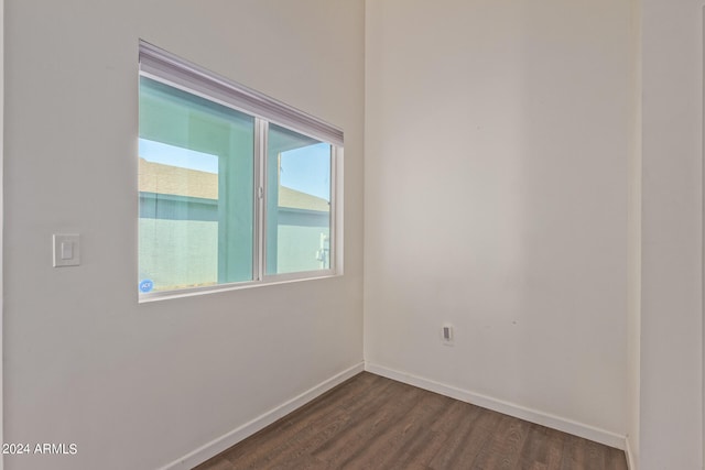 spare room featuring dark hardwood / wood-style flooring