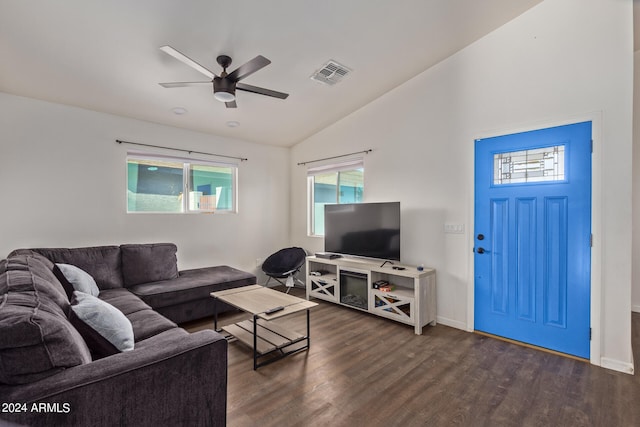 living room featuring ceiling fan, lofted ceiling, and dark wood-type flooring