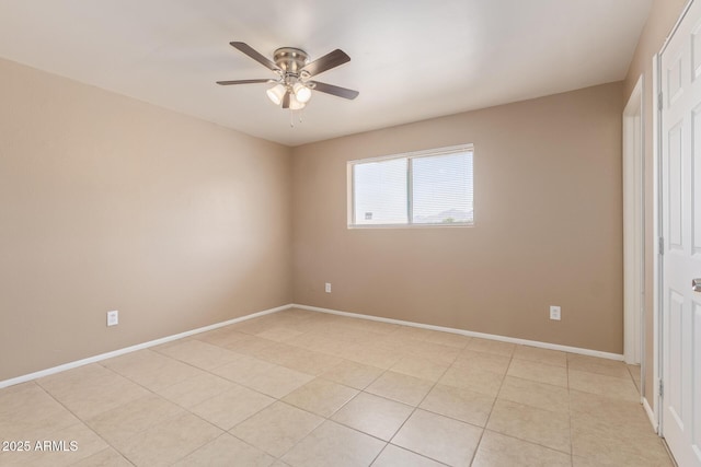 12547 W Warner St, Avondale, AZ 85323 - unfurnished bedroom featuring baseboards, a ceiling fan, and light tile patterned floors