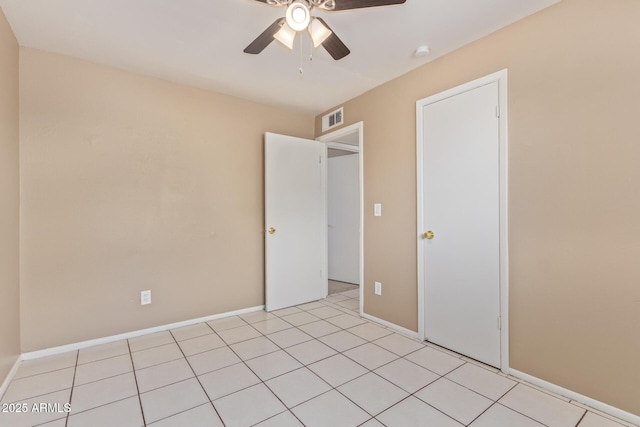 12547 W Warner St, Avondale, AZ 85323 - unfurnished bedroom with ceiling fan and baseboards