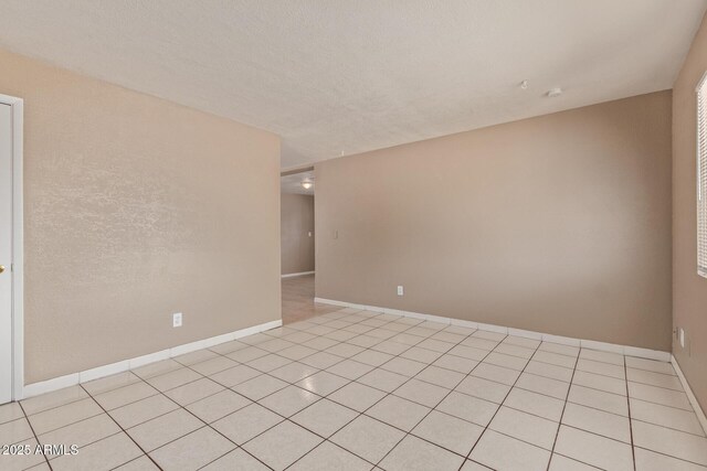 12547 W Warner St, Avondale, AZ 85323 - spare room with light tile patterned floors and baseboards
