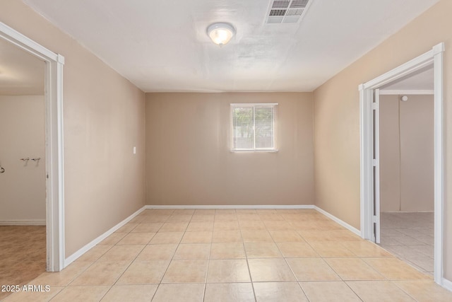 12547 W Warner St, Avondale, AZ 85323 - unfurnished room featuring baseboards and light tile patterned floors