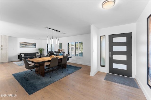 dining room with light hardwood / wood-style flooring