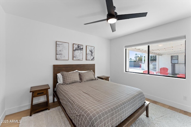 bedroom with hardwood / wood-style floors and ceiling fan