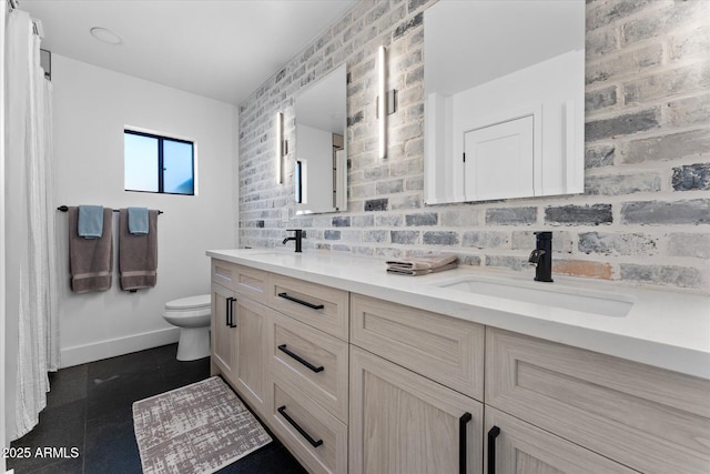 bathroom featuring toilet and vanity