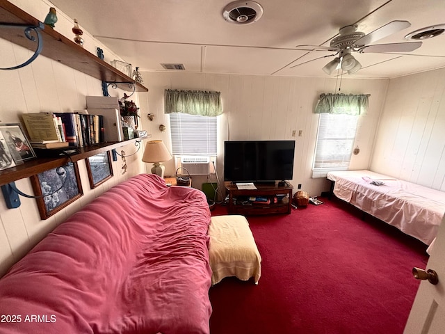 1025 N Sartillion Ave, Ajo, AZ 85321 - carpeted living room with a ceiling fan, wooden walls, and cooling unit
