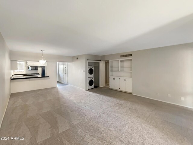 unfurnished bedroom with multiple closets, ceiling fan, and carpet flooring