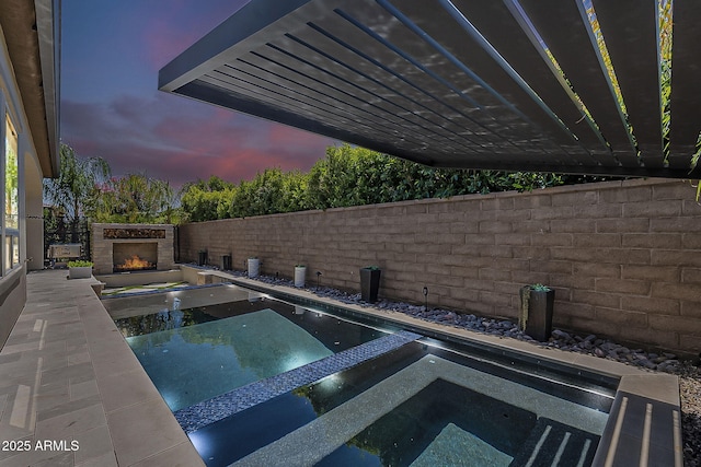 199 E Tangerine Path, Queen Creek, AZ 85140 - view of swimming pool with a pool with connected hot tub, a fenced backyard, and a patio area