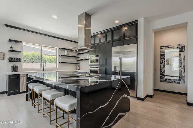 199 E Tangerine Path, Queen Creek, AZ 85140 - kitchen featuring appliances with stainless steel finishes, open shelves, a kitchen bar, island exhaust hood, and recessed lighting