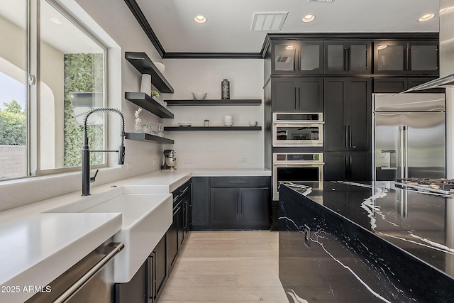 199 E Tangerine Path, Queen Creek, AZ 85140 - kitchen featuring appliances with stainless steel finishes, recessed lighting, light wood-style floors, glass insert cabinets, and open shelves