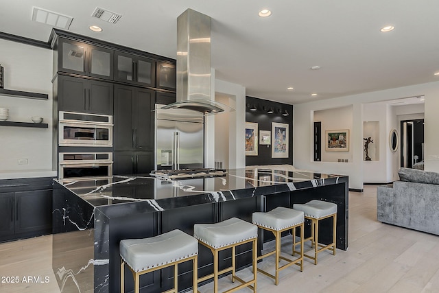 199 E Tangerine Path, Queen Creek, AZ 85140 - kitchen with island exhaust hood, built in refrigerator, a center island, light wood-style floors, and open floor plan