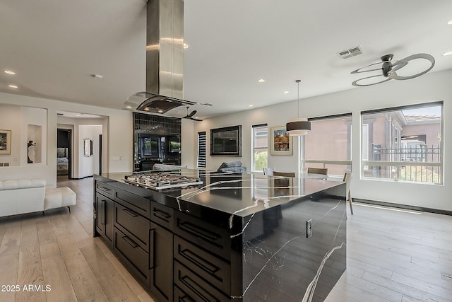 199 E Tangerine Path, Queen Creek, AZ 85140 - kitchen with island range hood, stainless steel gas stovetop, dark countertops, a ceiling fan, and recessed lighting