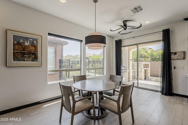 199 E Tangerine Path, Queen Creek, AZ 85140 - dining space with light wood-style floors and recessed lighting