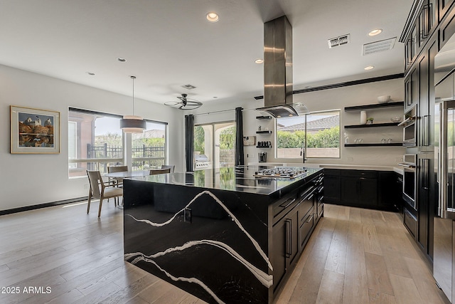 199 E Tangerine Path, Queen Creek, AZ 85140 - kitchen with open shelves, dark cabinetry, stainless steel appliances, a center island, and recessed lighting