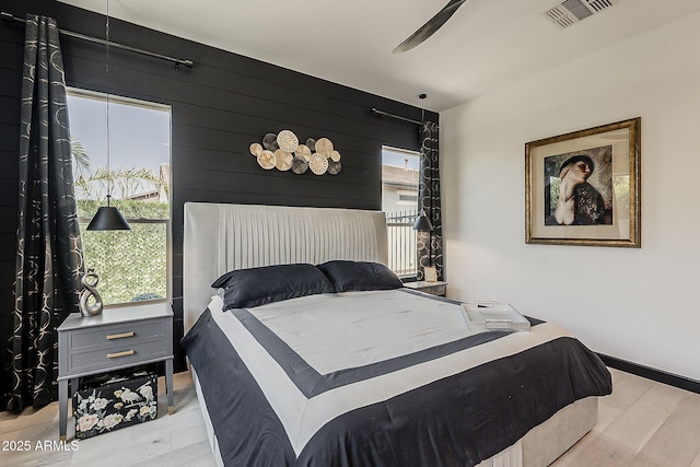 199 E Tangerine Path, Queen Creek, AZ 85140 - bedroom with multiple windows, wood finished floors, and wooden walls