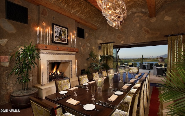 199 E Tangerine Path, Queen Creek, AZ 85140 - dining space with a tile fireplace, a chandelier, and brick ceiling