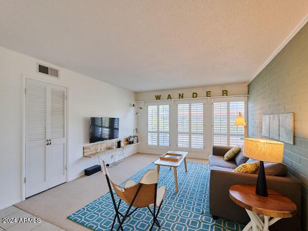 living room featuring a textured ceiling