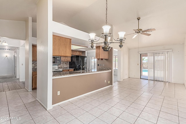 6032 W Grovers Ave, Glendale, AZ 85308 - kitchen with black appliances, light tile patterned flooring, a chandelier, ceiling fan, and brown cabinets