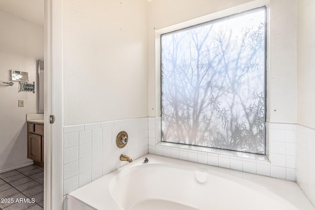 6032 W Grovers Ave, Glendale, AZ 85308 - bathroom featuring a garden tub, vanity, and healthy amount of natural light