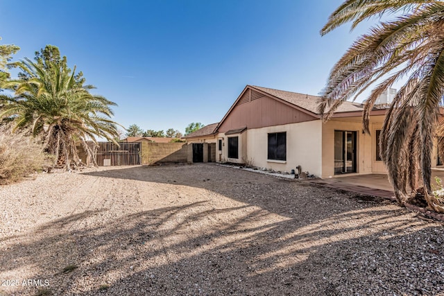 6032 W Grovers Ave, Glendale, AZ 85308 - rear view of property with roof with shingles and a patio