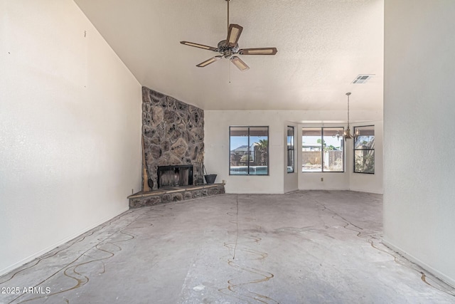 6032 W Grovers Ave, Glendale, AZ 85308 - unfurnished living room featuring a fireplace, a ceiling fan, lofted ceiling, concrete floors, and a chandelier
