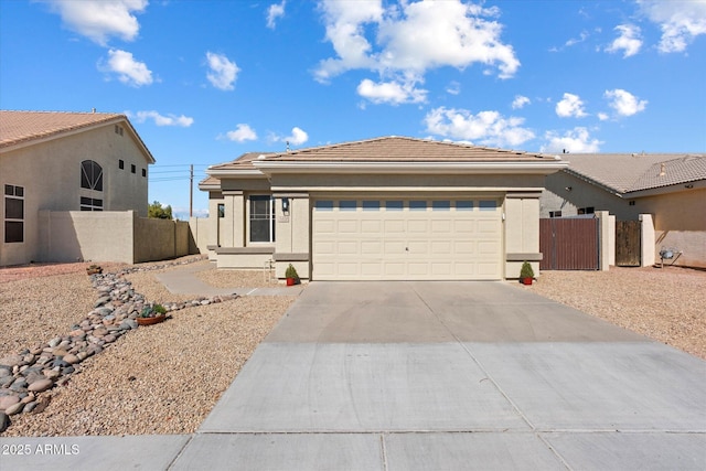 view of front of home featuring fence, stucco siding, concrete driveway, a garage, and a tile roof