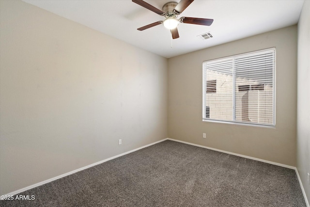 unfurnished room featuring carpet flooring, a ceiling fan, visible vents, and baseboards