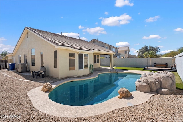 view of swimming pool featuring a patio area, central AC unit, a fenced in pool, and a fenced backyard