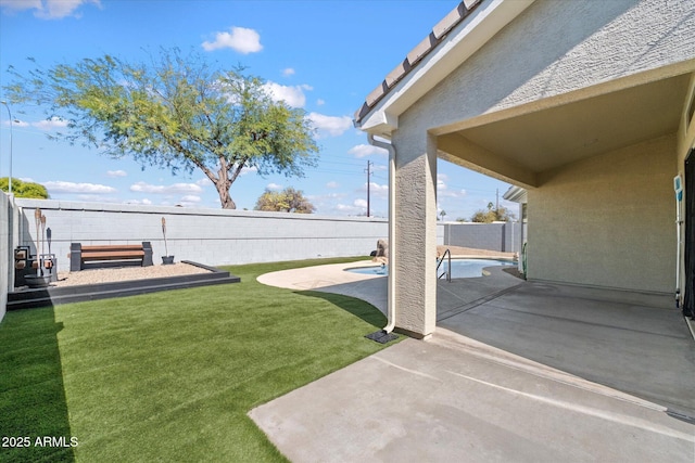 view of yard with a patio area, a fenced in pool, and a fenced backyard