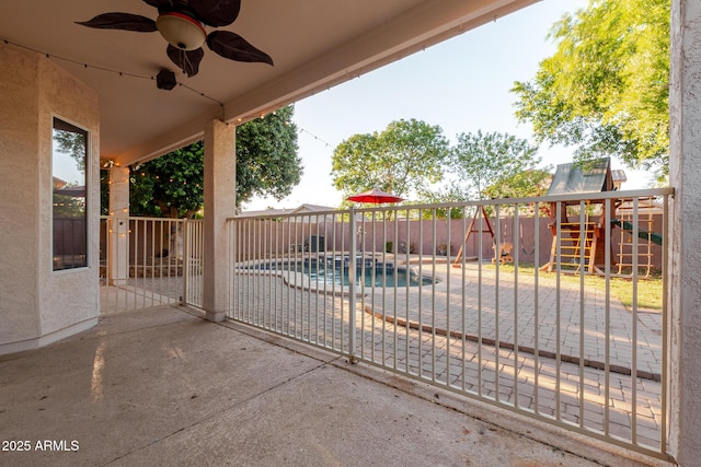 288 W Los Alamos St, Gilbert, AZ 85233 - view of patio with a playground, a fenced backyard, and a ceiling fan