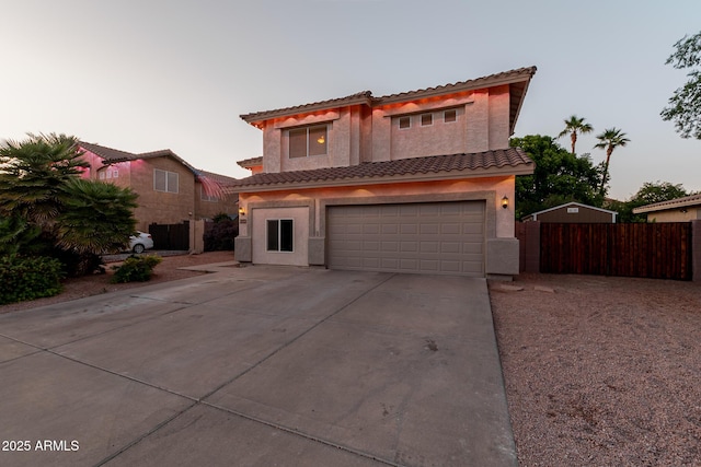 288 W Los Alamos St, Gilbert, AZ 85233 - view of front facade featuring stucco siding, driveway, a tiled roof, an attached garage, and fence