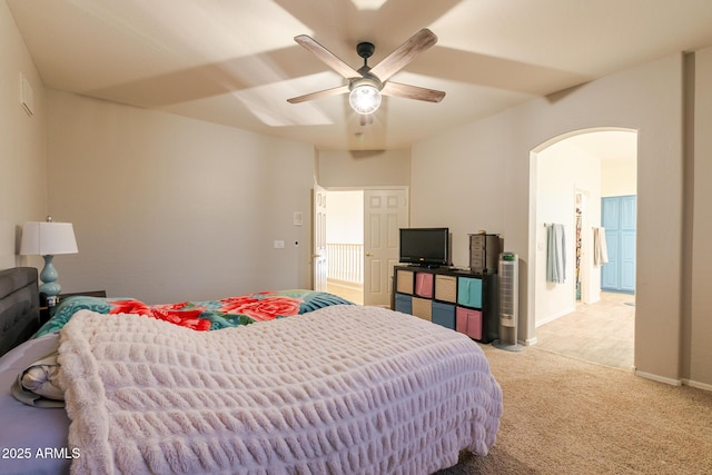 288 W Los Alamos St, Gilbert, AZ 85233 - bedroom with arched walkways, light carpet, baseboards, and a ceiling fan