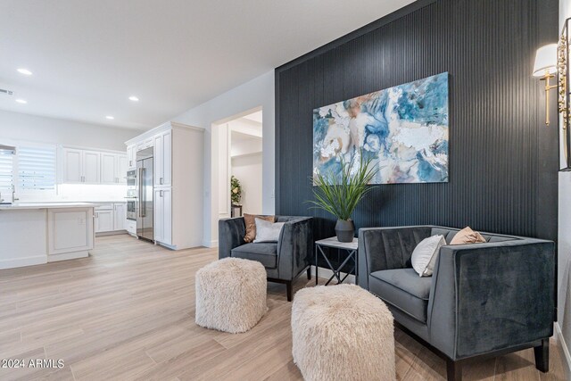 home office with light hardwood / wood-style floors