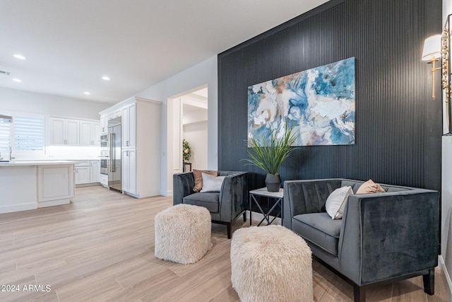 living area featuring light hardwood / wood-style floors