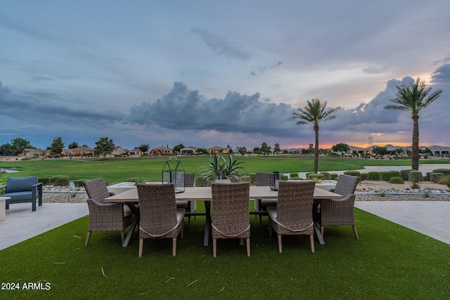 patio terrace at dusk with a lawn