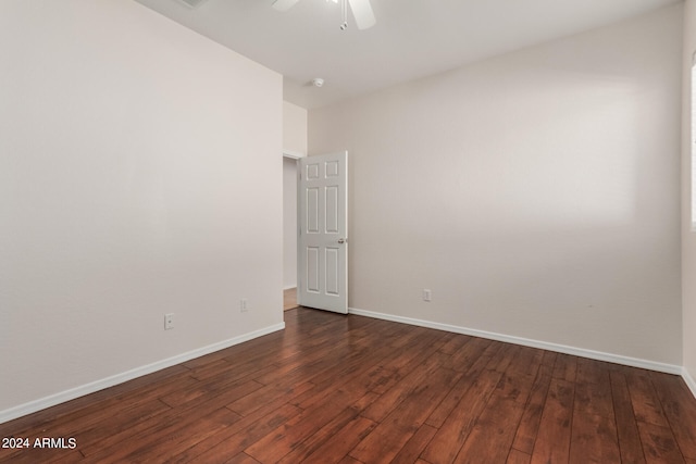 empty room featuring ceiling fan and dark hardwood / wood-style floors