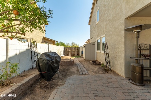 view of side of home with a patio