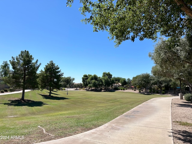 view of home's community featuring a lawn