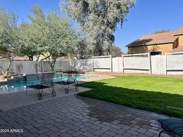 exterior space with a fenced in pool and a patio area