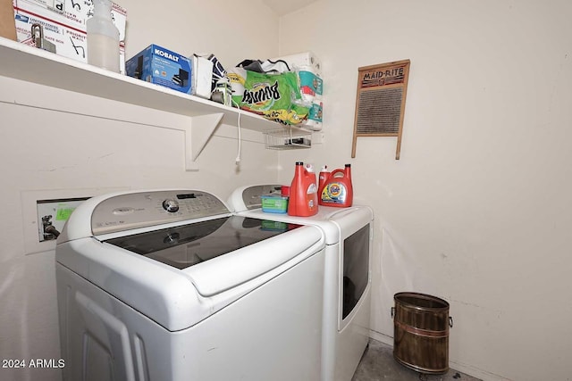 clothes washing area featuring independent washer and dryer