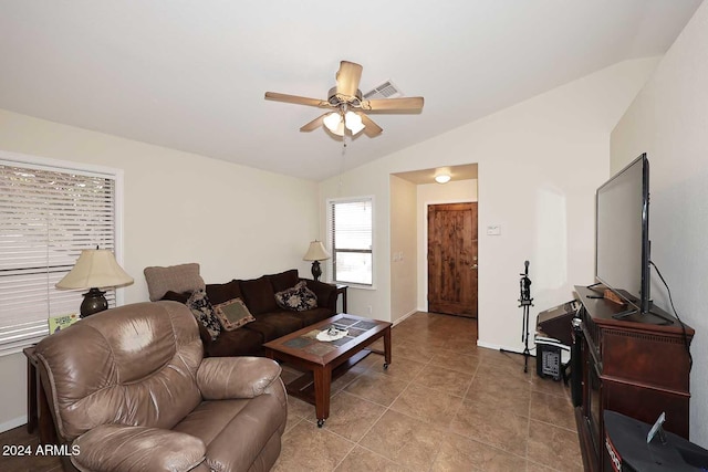 living room featuring ceiling fan and lofted ceiling